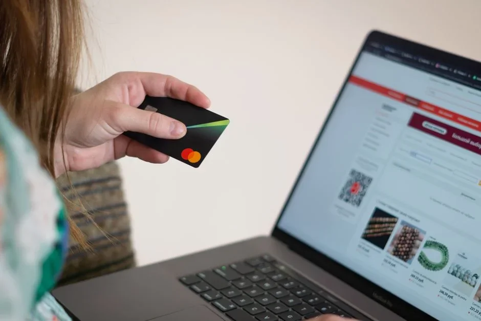 A person hesitating to type credit card numbers into a web form
