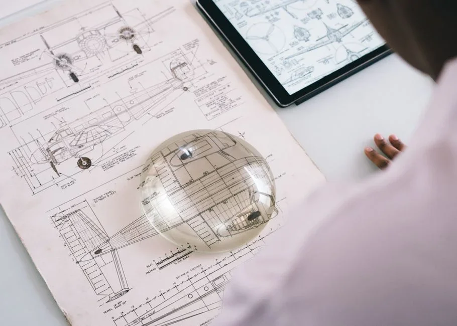 Magnifying glass over a complex digital network diagram